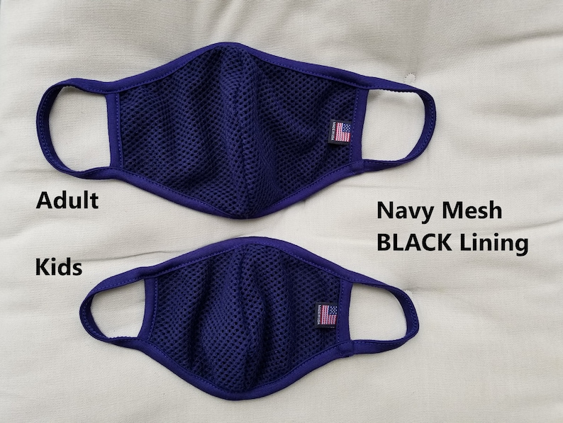 May include: Two navy blue mesh face masks with black lining. The larger mask is labeled "Adult" and the smaller mask is labeled "Kids". Both masks have a small American flag patch on the right side.