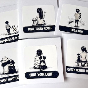 May include: A collection of five square greeting cards featuring black and white ink-style illustrations of children and dogs. Each card displays a unique scene with text including "MAKE TODAY COUNT," "LIFE IS NOW," and "SHINE YOUR LIGHT."