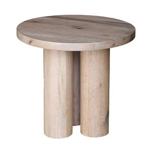 May include: A small, round side table made of light-colored wood. The tabletop is circular, supported by three cylindrical legs. The natural wood grain is visible throughout the table, giving it a rustic appearance. The table is approximately 18 inches in diameter and 20 inches tall.