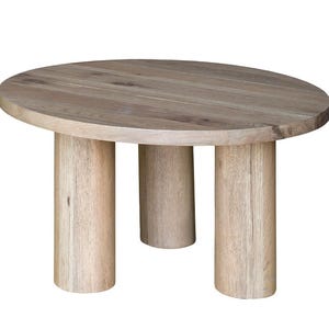 May include: A small, round wooden side table with a light brown finish. The tabletop is supported by three cylindrical legs. The table is made of natural wood and has a simple, modern design.