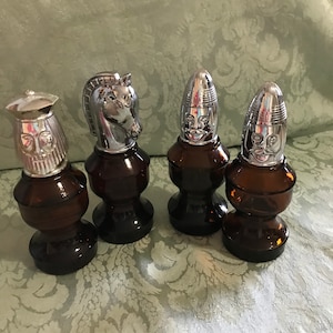 EA—Avon (four) Chess Pieces Assorted