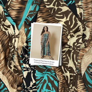 May include: A close-up of a fabric with a tropical patchwork stripe design. The fabric features a mix of brown, beige, black, and turquoise colours. A photo of a woman wearing a dress made from the fabric is in the image. The text on the photo says "Tropical Patchwork Stripe Printed Polyester Fabric."