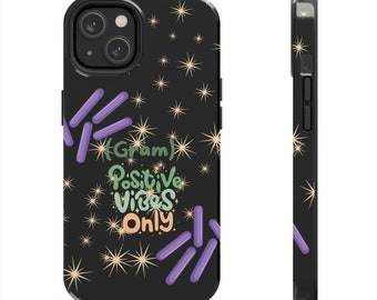 Może przedstawiać: Czarne etui na telefon z napisem "(Gram) Positive Vibes Only" w kolorze zielonym, pomarańczowym i białym. Etui zdobią fioletowe kształty i złote rozbłyski gwiazd.