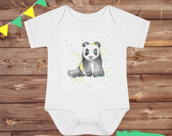 May include: White baby onesie with a watercolor illustration of a panda bear with blue eyes and yellow and green splatters in the background. The onesie has the text "6-18 Months" printed on the bottom.