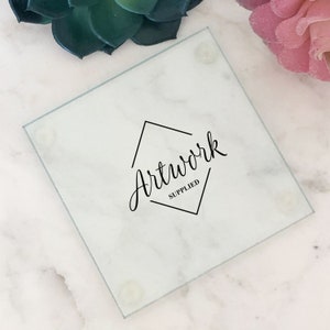 May include: A white square glass coaster with a black geometric design and the text "Artwork Supplied".