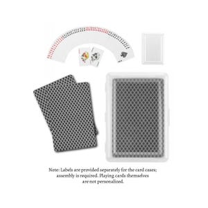 May include: A deck of playing cards with a white plastic case. The cards are fanned out, showing the suits and numbers. Two cards are face up, and two stacks of cards are visible. The case has a diamond pattern.