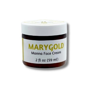Peut inclure: Pot de crème pour le visage MARYGOLD Manna. Le pot marron est surmonté d'un couvercle blanc. L'étiquette affiche "MARYGOLD" en or, "Manna Face Cream" et "2 fl oz (59 ml)". Contient 59 ml.