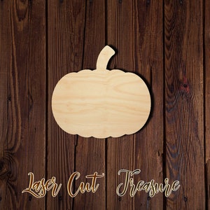 May include: A wooden pumpkin cutout, perfect for crafting and decorating. The cutout is made of unfinished wood and has a natural wood grain.