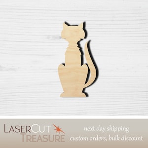 May include: A wooden cutout of a cat in a sitting position. The cutout is unpainted and has a natural wood color.