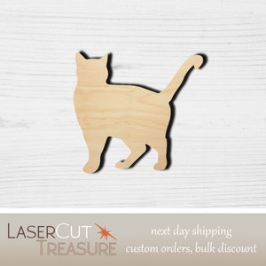 May include: A wooden cutout of a cat in a standing position. The cutout is made of unfinished wood and has a natural wood grain.