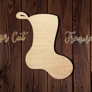 May include: A laser cut wooden stocking shape, with the words "Laser Cut Treasure" written on the wood background.