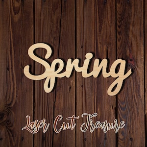 May include: Wooden cutout of the word "Spring" in a cursive font. The cutout is on a brown wood background. The text "Laser Cut Treasure" is visible below the word "Spring".