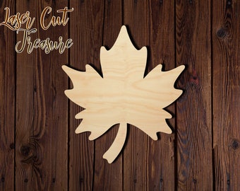 May include: A wooden maple leaf cutout, perfect for crafting projects. The leaf is unpainted and has a natural wood finish.