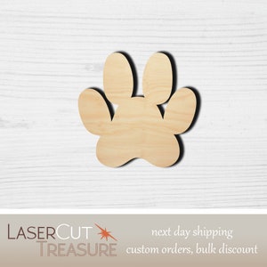 May include: A wooden paw print cutout, perfect for crafting projects. The paw print is made of natural wood and has a light brown color.