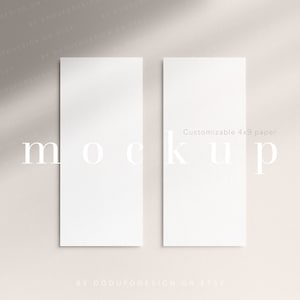 May include: Two blank white cards, 4x9 inches, on a light beige background. The cards are positioned vertically, side by side, with the text "mockup" printed in white below the cards. The text "Customizable 4x9 paper" is printed in white on the right card. The text "BY DODUEODESIGN ON ETSY" is printed in white at the bottom of the image.