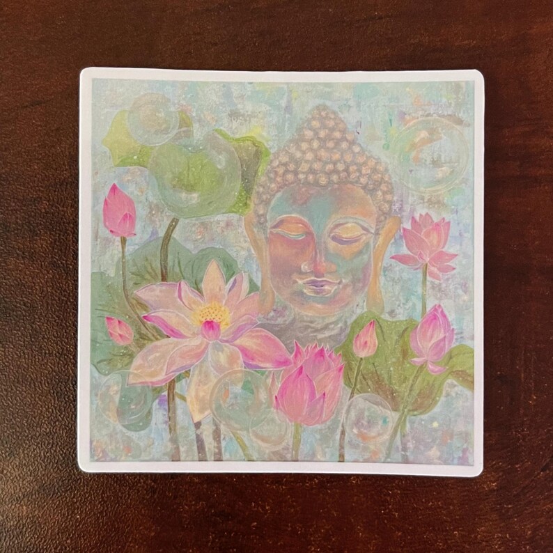 May include: A watercolor painting of a serene Buddha surrounded by pink lotus flowers. The background is a soft blue with white and gray swirls.