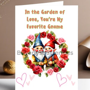 May include: A greeting card with a watercolor illustration of two gnomes standing in a wreath of pink and red roses. The text on the card reads "In the Garden of Love, You're My Favorite Gnome."