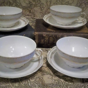 Four O E G Royal Austria Cups and Saucers