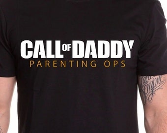 May include: Black t-shirt with a white graphic that says "Call of Daddy Parenting Ops".