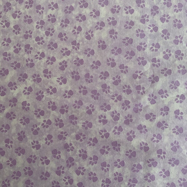 Lavender Pet Paw Fabric sold by the half yard. “Dog On It” by Ann Lauer for Bernatex. Pet theme fabric, dog print, cat print