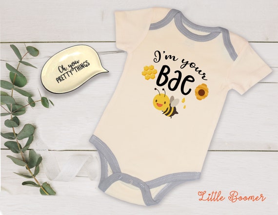baby clothes with bees