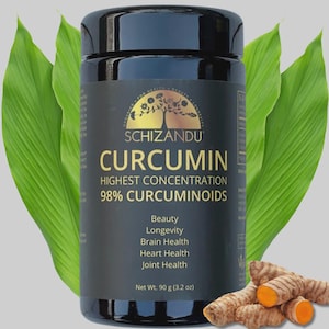 Pode incluir: Uma garrafa preta de Schizandu Curcumin com folhas verdes e raízes de açafrão-da-terra. O rótulo destaca "Highest Concentration 98% Curcuminoids" e lista benefícios. Peso líquido: 90 g.