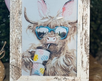 Sassy Easter Highland Cow with Bunny Ears Sipping Tumbler  In Distressed Frame Sign