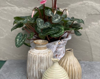 Group of three rustic ceramic stone vases