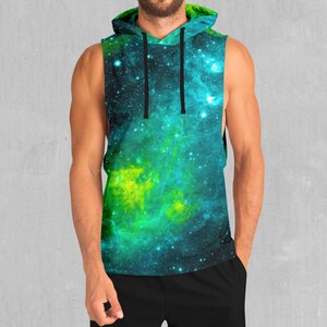 May include: A sleeveless hoodie with a green and blue galaxy print. The hoodie has a black drawstring and a hood.