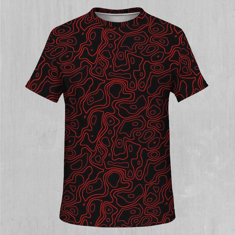 May include: A black t-shirt with a red abstract pattern of swirling lines.