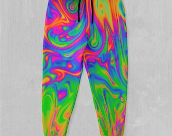 May include: Jogger pants with a vibrant, swirling psychedelic pattern in shades of pink, green, yellow, and blue. The pants have a black drawstring and elastic cuffs. The overall design is a colorful, abstract print.
