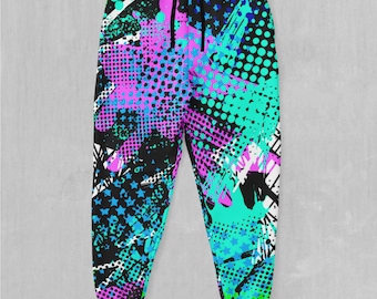 May include: Black sweatpants with a colorful abstract print featuring pink, blue, and green paint splatters, stars, and polka dots.