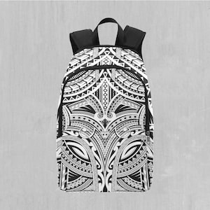 May include: Black and white backpack with a tribal pattern design. The pattern is intricate and detailed, featuring geometric shapes and lines.