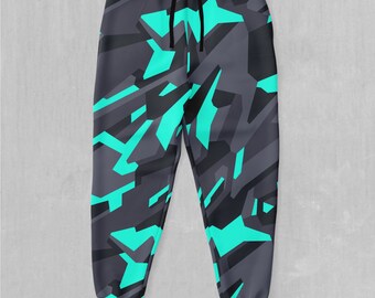 May include: Grey sweatpants with a geometric camouflage pattern in turquoise.