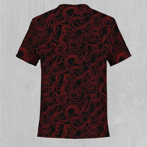 May include: Black t-shirt with a red topographic pattern.