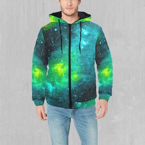 May include: A black zip-up hoodie with a green and blue galaxy print. The hoodie has a drawstring hood and a front pocket.
