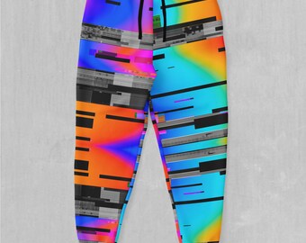 May include: A pair of colorful sweatpants with a glitch-style pattern in shades of orange, blue, pink, and black.