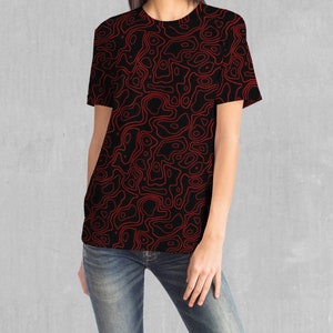 May include: A black t-shirt with a red abstract pattern of swirling lines.