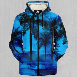 May include: A blue zip-up hoodie with a palm tree print. The hoodie has a black zipper and a black drawstring hood.