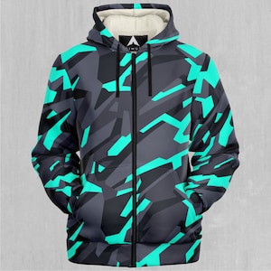 Könnte beinhalten: Ein schwarzer und türkisfarbener Reißverschluss-Hoodie mit geometrischem Tarnmuster.