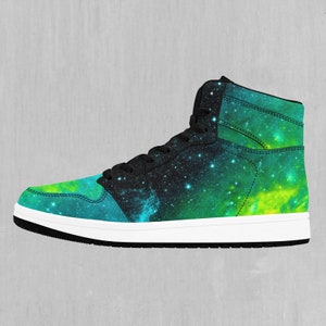 May include: High-top trainers with a black, green and blue galaxy print. The shoes have a white sole and black laces.