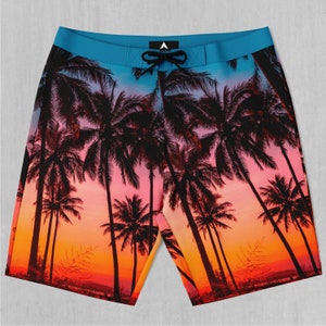 May include: Blue and orange patterned swim trunks with a sunset and palm trees design.