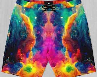 May include: A pair of colorful swim trunks with a galaxy-like print. The print features shades of blue, pink, yellow, and green.