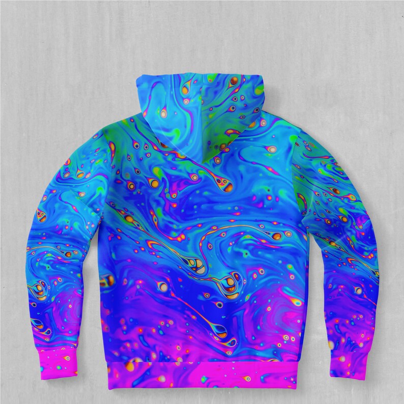 May include: A blue and pink hoodie with a psychedelic swirl pattern. The hoodie has a hood and long sleeves.