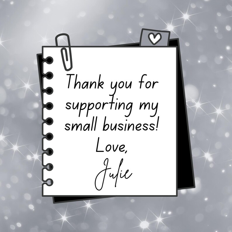 May include: A handwritten thank you note on a white sheet of paper with a black border. The note says "Thank you for supporting my small business! Love, Julie".