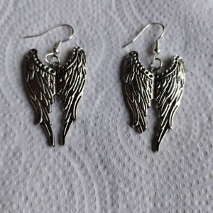 Silver colored angel wing earrings