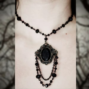 Rosary style beaded necklace