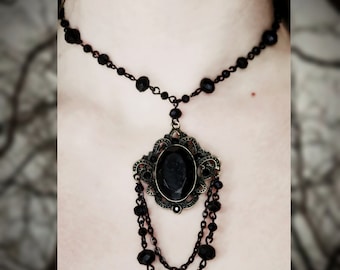 Rosary style beaded necklace