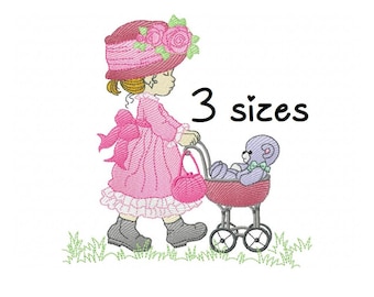 May include: Embroidered design of a girl in a pink dress and hat pushing a stroller with a teddy bear inside. The text "3 sizes" is written in black above the stroller.