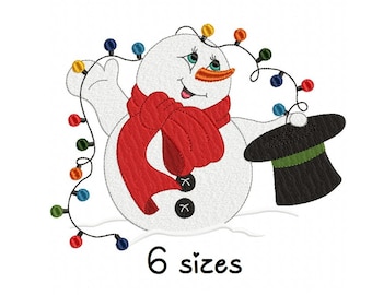 May include: A white snowman with a red scarf and a black top hat is holding a string of colorful Christmas lights. The snowman is smiling and has a carrot nose. The text "6 sizes" is below the snowman.